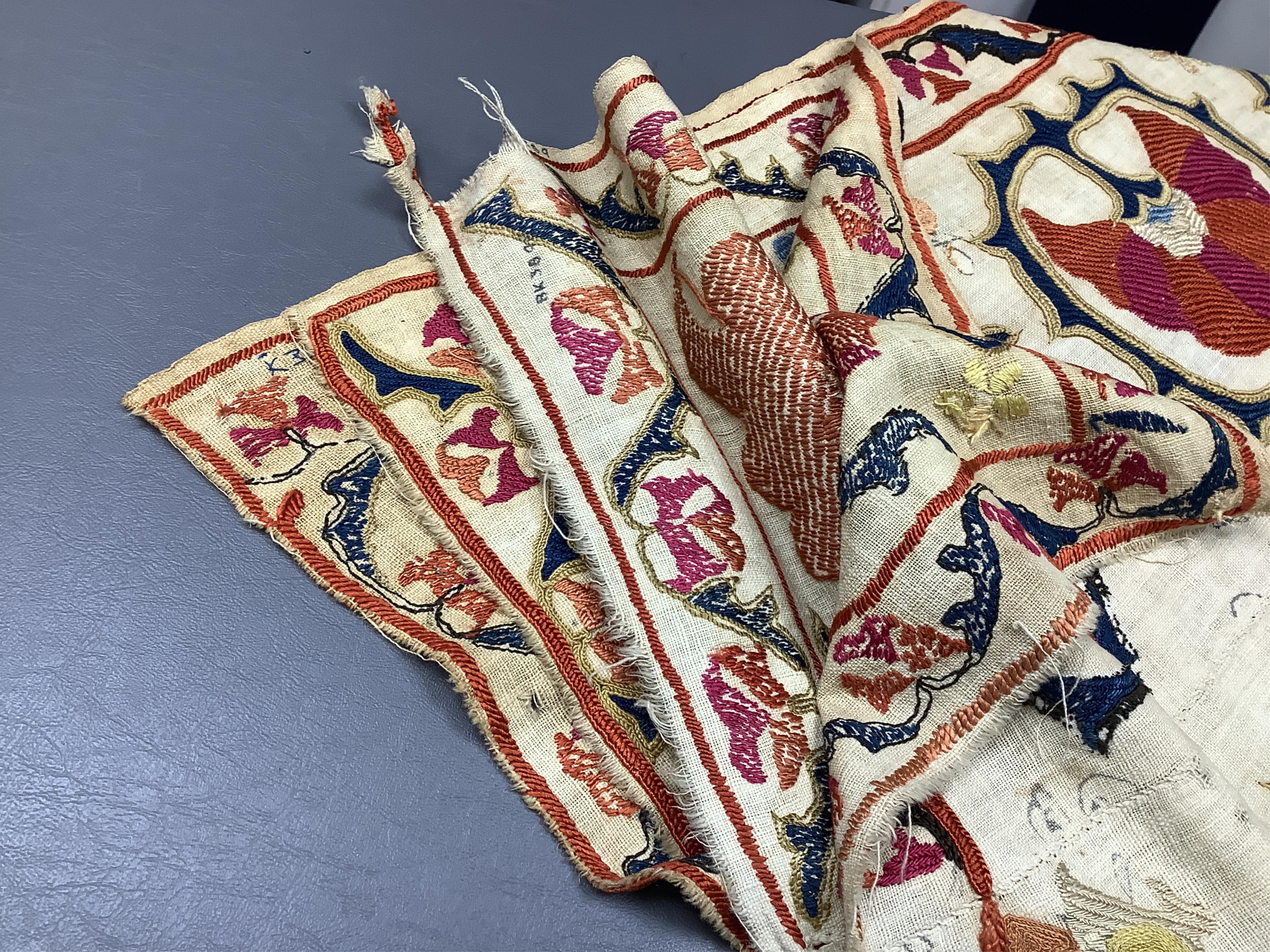 A 19th century Uzbekistan Suzani, hand embroidered hanging. Made from hand woven linen panels each approximately 28cm wide x 167cm long. Hand embroidered with silk hand dyed threads, in orange, red, blue and yellows, usi